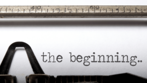 a typewriter with the words "the beginning.." zoomed in on